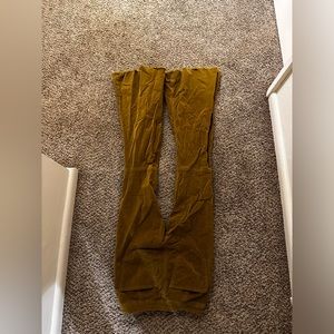 Small, flare out jeans that are a Carmel color